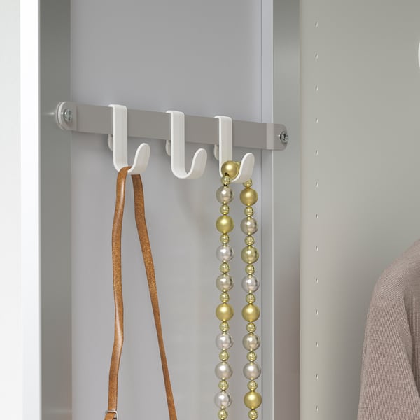 White closet organiser with belt and necklaces: STRAUMEN.