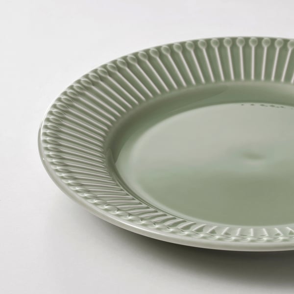 Green plate with textured edge.