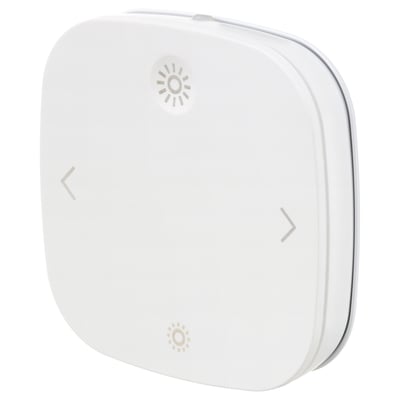 A white, square-shaped STYRBAR remote control made of abs plastic. It three illuminated symbols for controlling smart lighting.