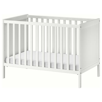 A white wooden SUNDVIK crib with adjustable mattress height and removable side panel, designed for baby safety and comfort.