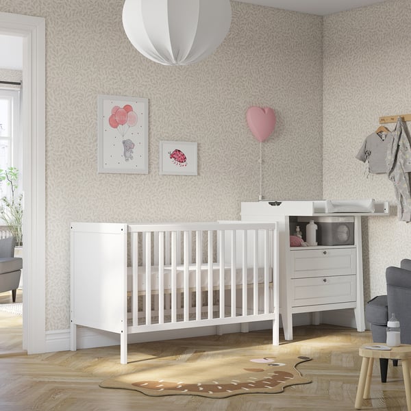 SUNDVIK cot: white, solid beech, rectangular, minimalist. Smaller than dresser, fits room corner.