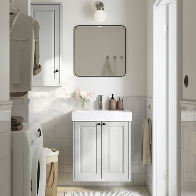 Modern compact bathroom with TÄNNFORSEN cabinet, sink, mirror, and grey towels