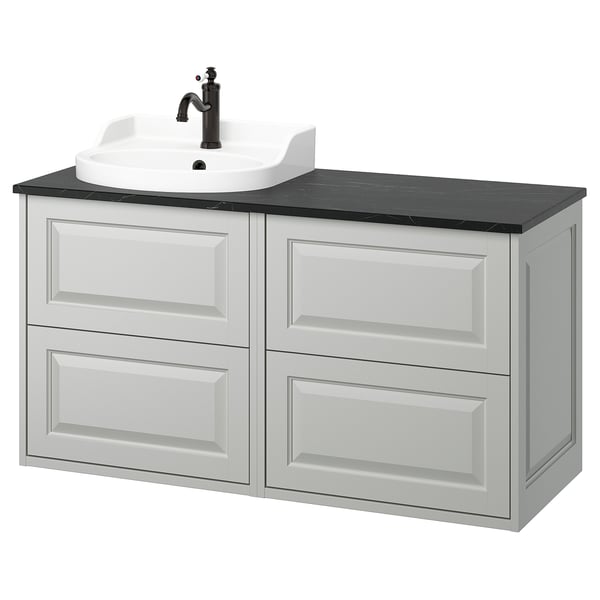 TÄNNFORSEN light grey bathroom cabinet with drawers, white basin, black countertop.