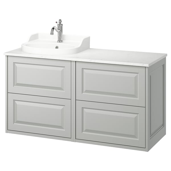White tannforsen bathroom vanity, marble counter, chrome faucet.