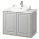 TÄNNFORSEN light grey bathroom cabinet with white sink.