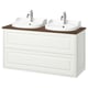 Double white bathroom vanity with wood top, two sinks, chrome faucets, classic design.