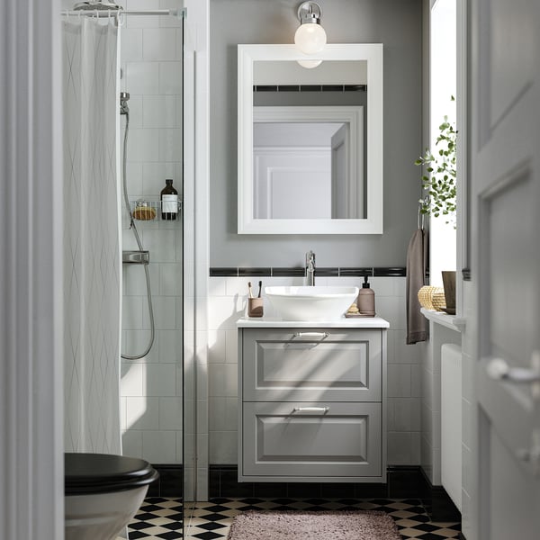 Grey bathroom with TÄNNFORSEN vanity & glass shower