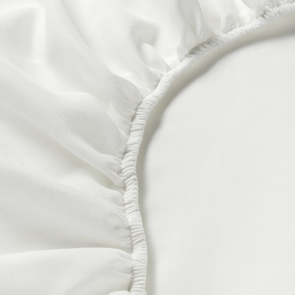 White bed sheet with elastic edge, showcasing quality stitching and fitted design.