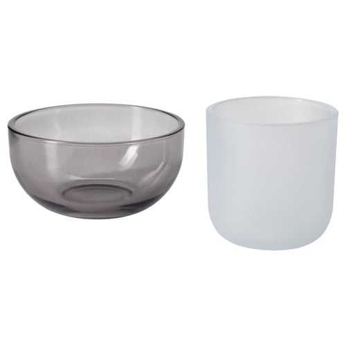 Set of 2 TALLTITA glass tealight holders, one grey, one white, round shape, simple design.