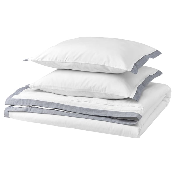 Folded white and grey bedding set, including comforter and pillows, crisp, minimalist design.