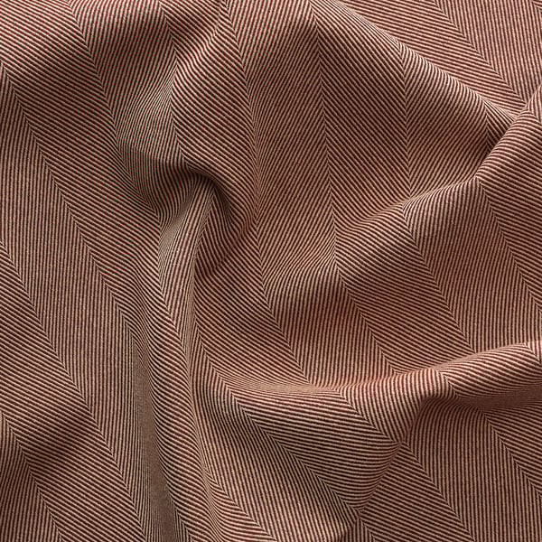 Wrinkled maroon fabric with subtle white stripes, showing texture and weave detail.