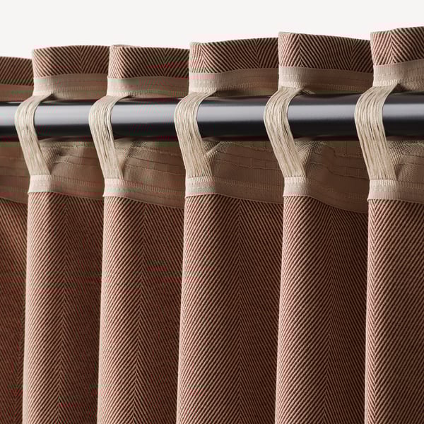 Curtains with rod pockets for easy hanging, darkening room by blocking light.