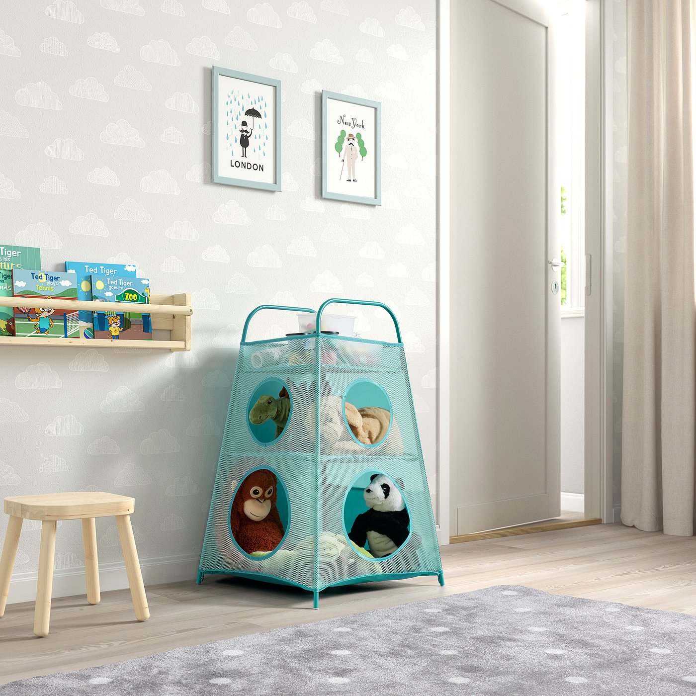 Kids playroom with TIGERFINK blue mesh toy storage. Holds stuffed animals, books, and small stool. Bright, organised, and inviting.