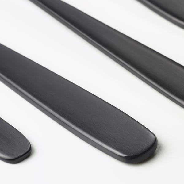 Modern, sleek black cutlery set; includes knife and spoon, polished stainless steel finish.