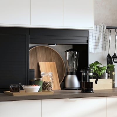Modern kitchen with TITTEBO appliance garage, sleek black and wood design, hiding blender and coffee maker, saving counter space.