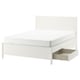Off-white TONSTAD bed with storage drawers and adjustable bed sides.