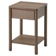 This image shows an IKEA TONSTAD bedside table. It is brown, square, with a single drawer and wooden legs. A classic, timeless design.