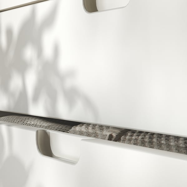 TONSTAD cabinet with white drawers and silver handles.