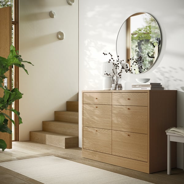 TONSTAD dresser with 6 drawers and plant decor.