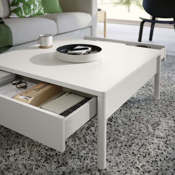 Off-white coffee table, TONSTAD series, with two soft-close drawers, modern design.