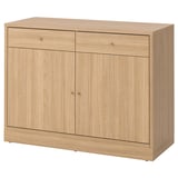 A TONSTAD light brown wooden sideboard with two doors and two drawers, featuring a classic design and brushed veneer finish.