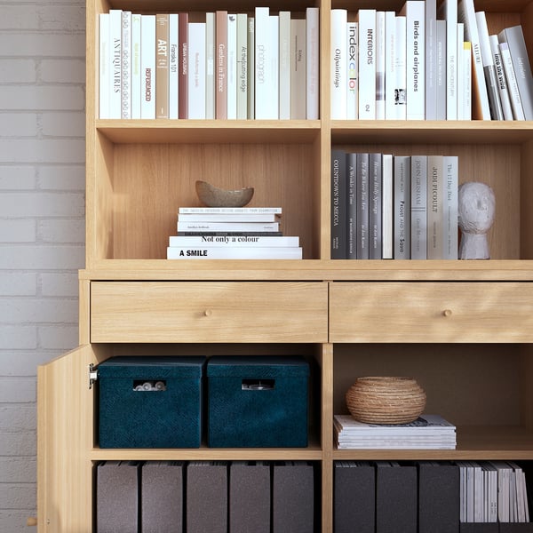 Bookshelf with adjustable shelves and storage boxes. Brushed veneer finish offers a unique look.