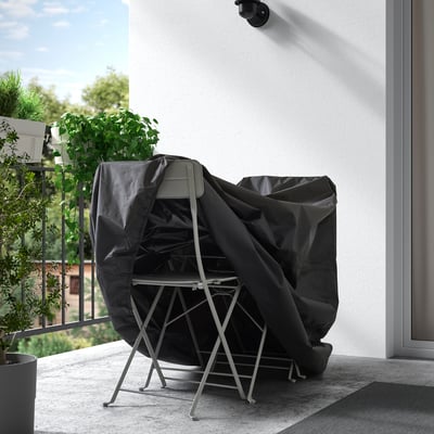 Balcony cover protects outdoor furniture from rain and dust.