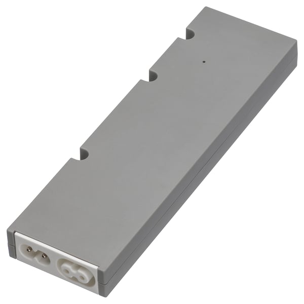 Rectangular grey TRÅDFRI smart lighting driver with plastic casing and white connector ports.