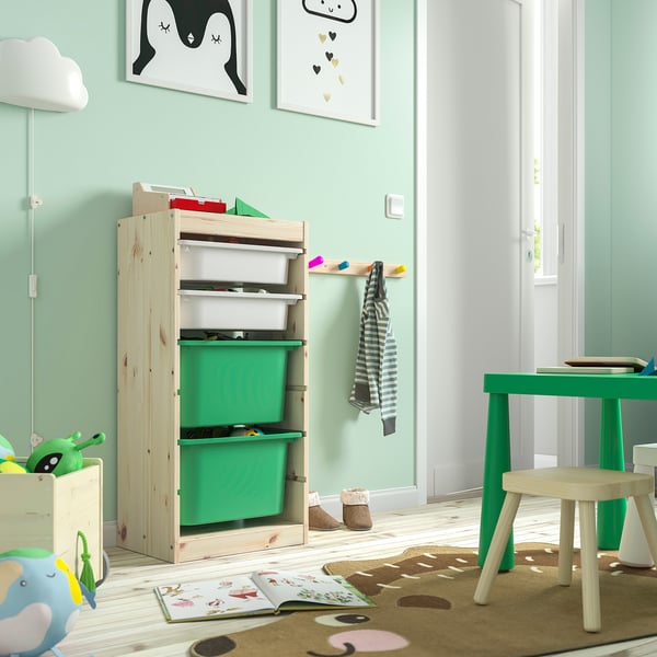 Kids room with TROFAST storage in light wood & green, perfect for toys & books.