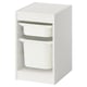 Product: TROFAST white storage unit, rectangular shape, three open compartments with plastic bins, modular design.