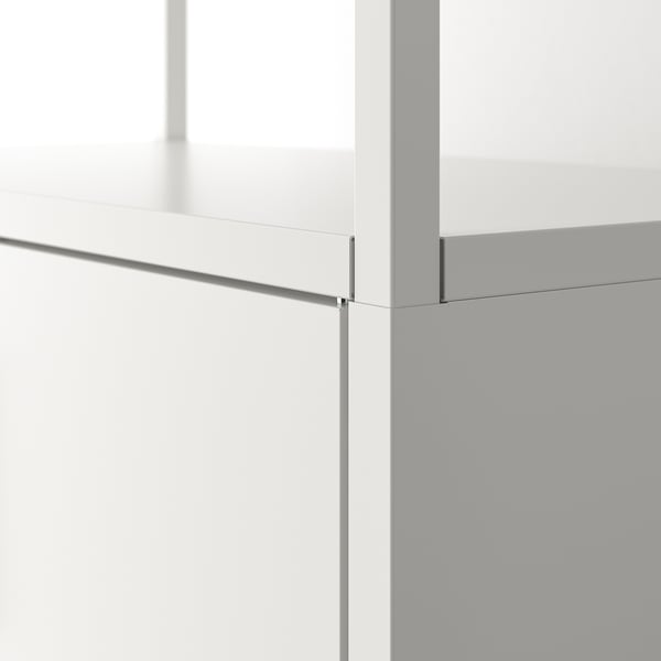 Minimalist TROTTEN storage unit, smooth white surfaces, sleek metal edges, modern design.