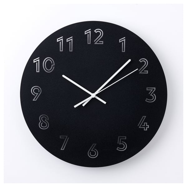 Black round modern wall clock with white hands and numbers showing 2:42.