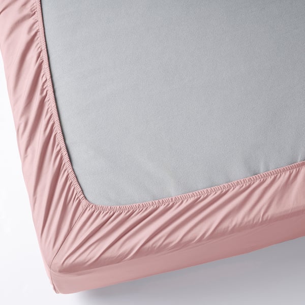 A fitted sheet with elastic edges, covering a mattress. It has a tight percale weave, soft and breathable fabric.