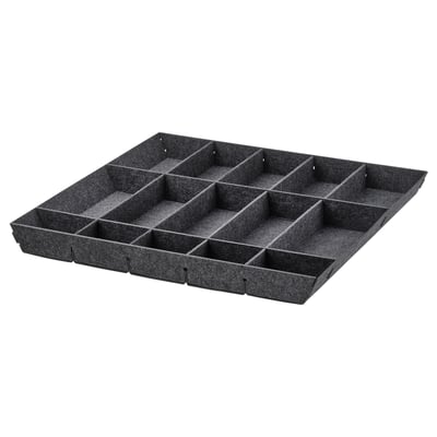 A black UPPDATERA drawer organiser with multiple compartments for storing kitchen items.