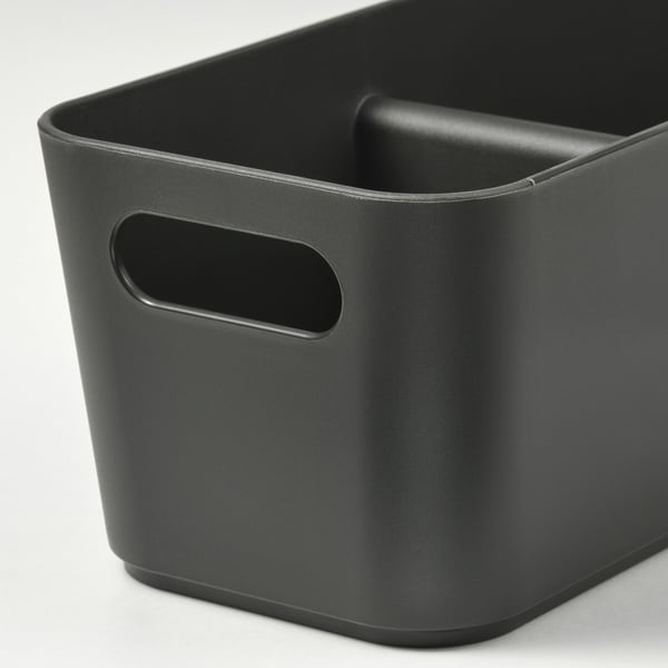 Black plastic storage container with two handles and cutouts for easy carrying.