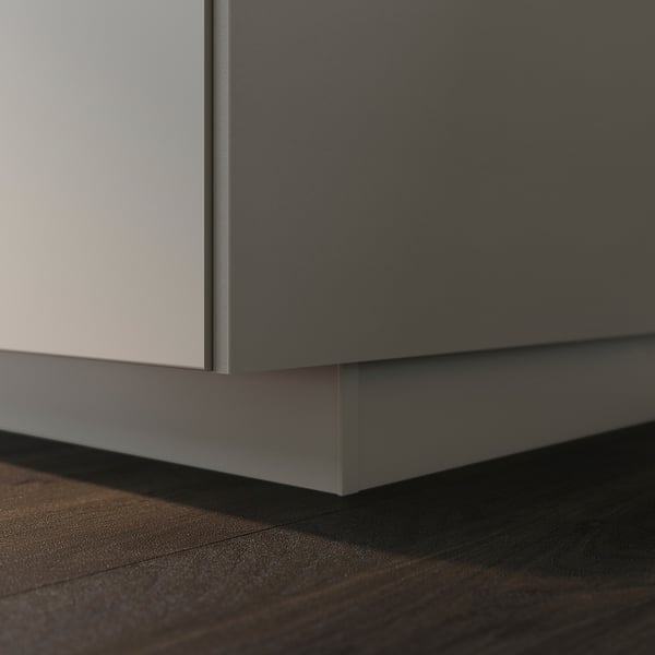 UPPLÖV plinth in matt beige fits cabinets, hiding floor gap.