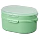 A UTBJUDA, a mint green stackable lunch box made of polypropylene plastic, with two tiers for separate food storage.