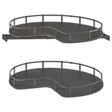 Two dark grey, corner cabinet carousels with circular trays and safety rails.