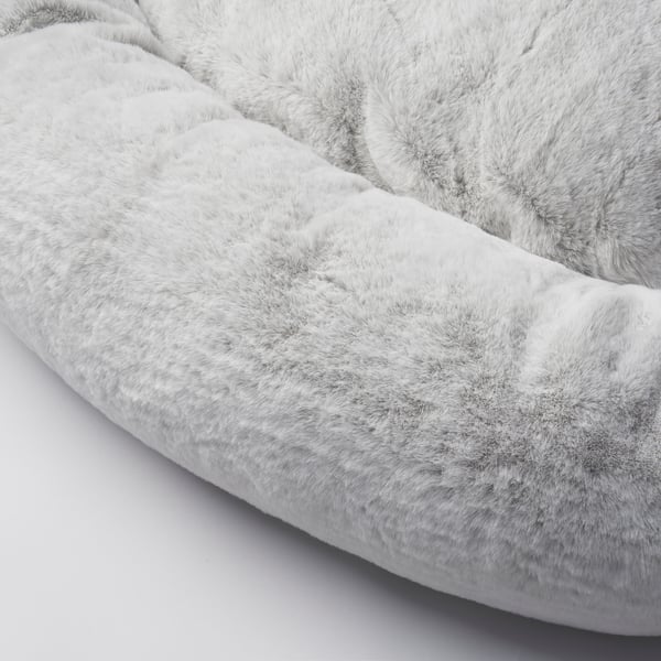 Cosy, circular dog bed with soft, plush fur. Designed for comfort and warmth, ideal for pets to curl up and relax.