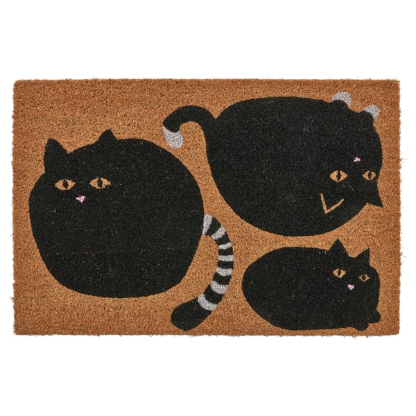 A brown doormat with black cat designs made of coir. There are three cartoon-style black cats with expressions on a light brown background.