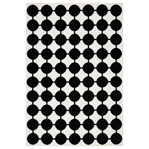 VÄNDPLATS black-white dotted rug, modern geometric pattern, rectangular shape, soft low pile, made of polypropylene.