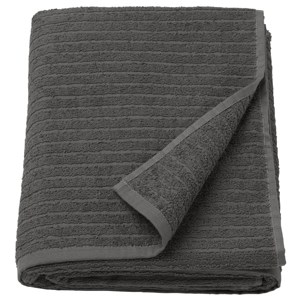 Dark grey VÅGSJÖN cotton towel with striped texture for softness and absorbency.