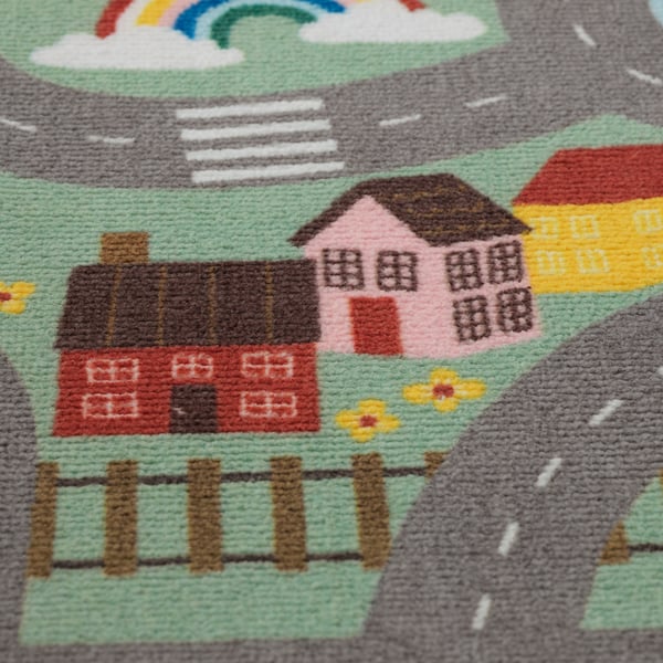 Vibrant, cosy rug with playful house designs, perfect for kids playtime.