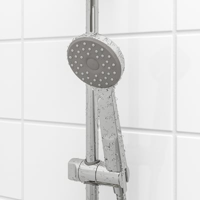 Shower head with full spray function, chrome finish, mounted on wall.