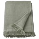 A green VALLASÅN towel with a textured waffle pattern and fringed edges, folded neatly. Its made from a soft cotton and viscose blend.