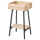 An ikea VANILJSTÅNG plant stand. Its a light wooden crate with black metal legs, perfect for displaying plants or decor.