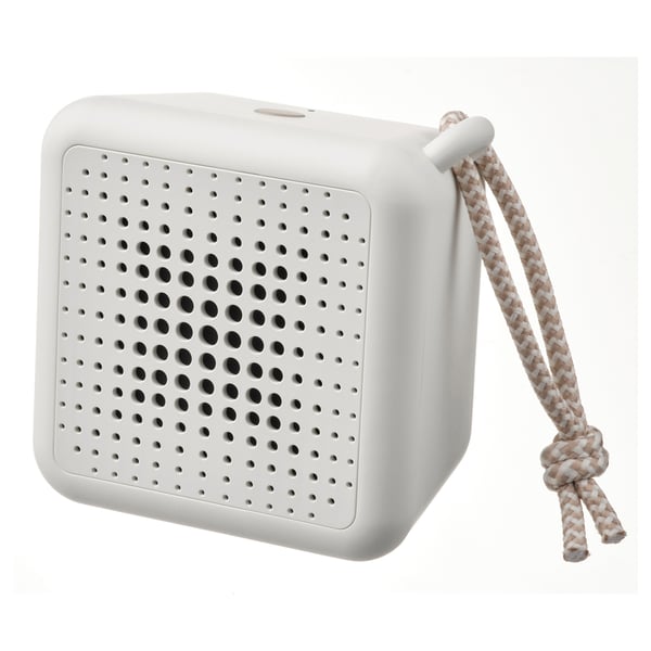 Depicts a white, portable VAPPEBY speaker featuring a grid of tiny holes for sound and a braided rope for carrying, set against a white background.