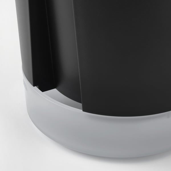 Modern self-watering planter with frosted base, sleek black design, simplicity and efficiency.