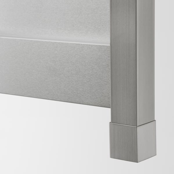 Close-up of sleek, stainless steel kitchen cabinet edge, showcasing smooth finish and quality craftsmanship.