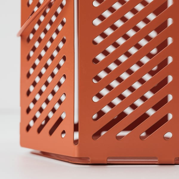 Close-up of orange VÅRSYREN lantern, showcasing its diagonal slatted design and sturdy construction.